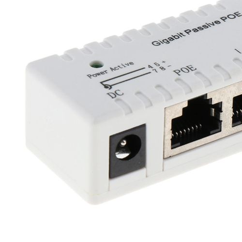 A white Generic Gigabit Power Over Ethernet (PoE) Injector with Ethernet ports and a power input jack.